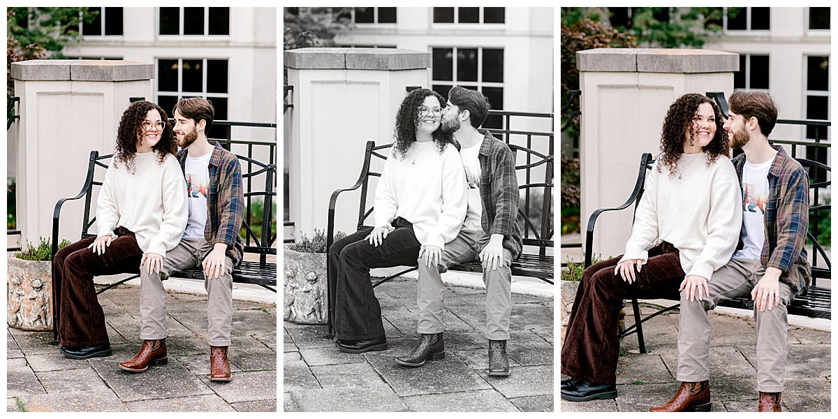 peyton-emma-rose-garden-bench-stairs.jpg Peyton and Emma sitting on a stone bench in the rose garden at Birmingham Botanical Gardens, with concrete stairs, an iron railing, and a bridge leading into the building visible behind them.